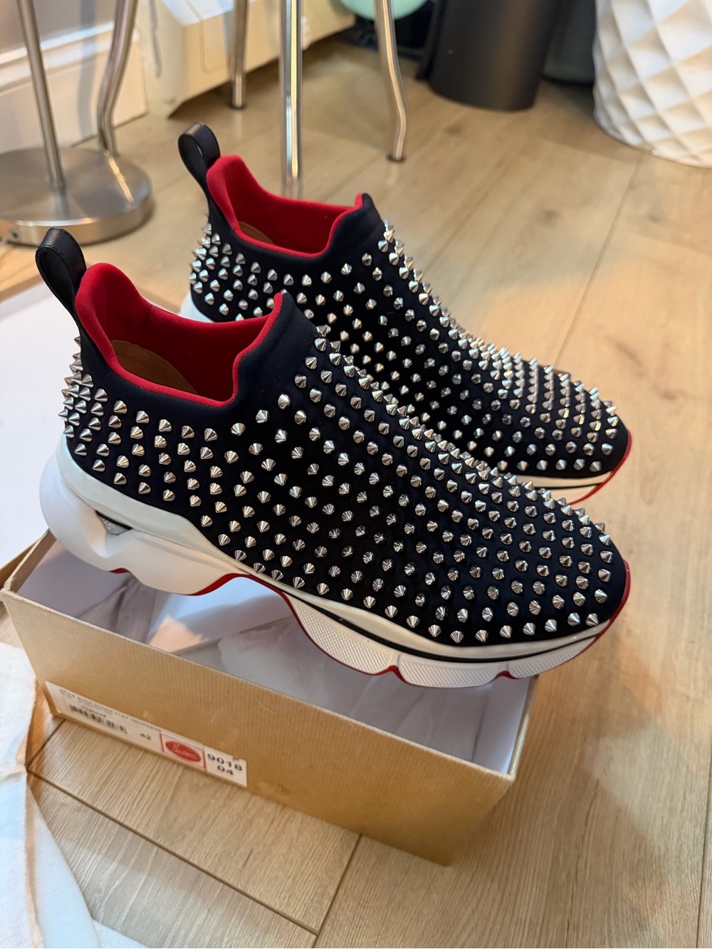Christian Louboutin Black Slip-On Studded Sneakers with Red Lining